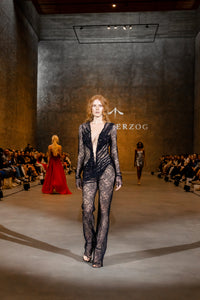 Lace jumpsuit with a deep V-neckline and appliqués