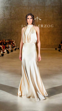 Long halterneck satin dress with draped neckline